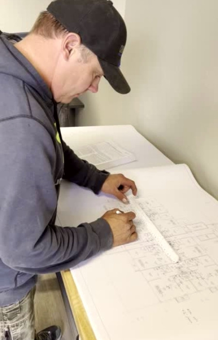 Dave reviewing plumbing plans